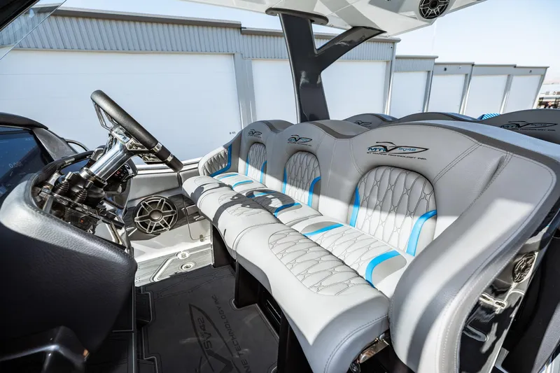  Yacht Photos Pics 2023 MTI V42 boat interior with modern steering and cushioned seating.