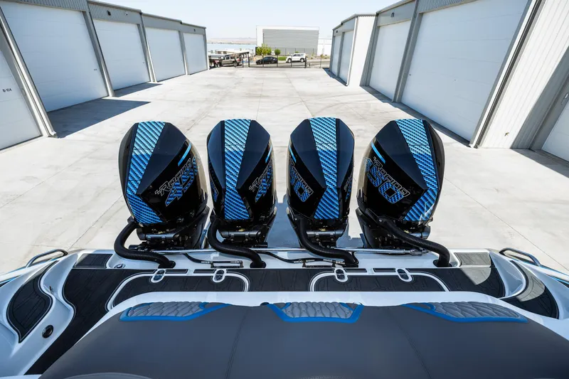  Yacht Photos Pics 2023 MTI V42 boat with four powerful outboard engines in a storage facility.