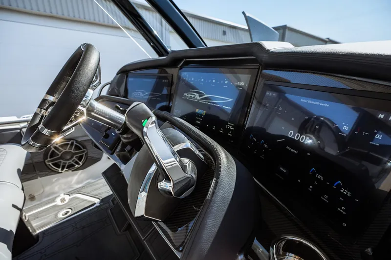  Yacht Photos Pics 2023 MTI V42 boat dashboard with advanced digital displays and steering wheel.