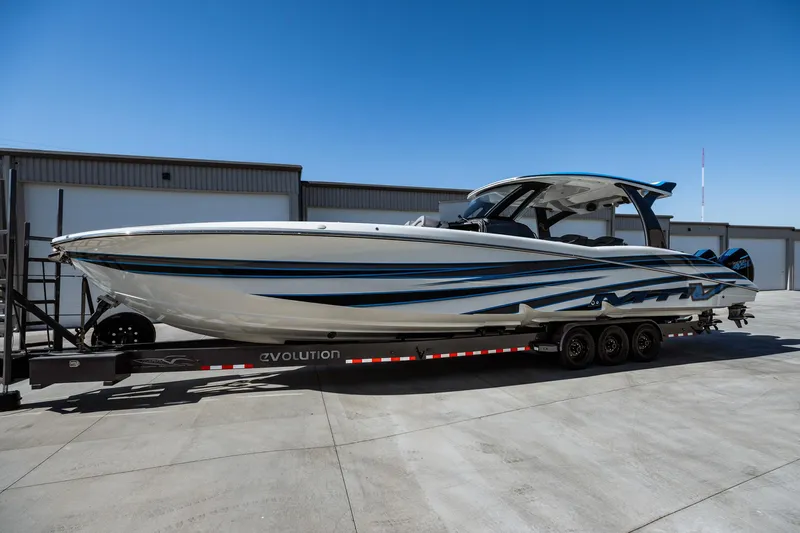  Yacht Photos Pics 2023 MTI V42 boat on a trailer in a storage facility.