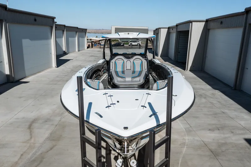  Yacht Photos Pics 2023 MTI V42 boat docked in a marina storage area.