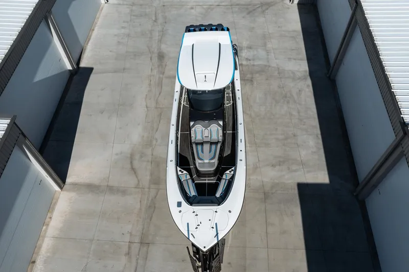  Yacht Photos Pics Top view of a 2023 MTI V42 boat in a storage facility.