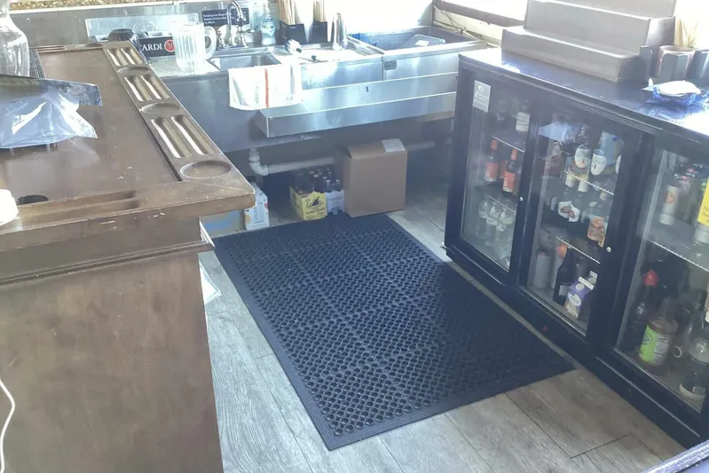 Indian River Queen Yacht Photos Pics Bar area with sink, beverage cooler, and rubber mat, Custom Paddle Wheel, 1984.