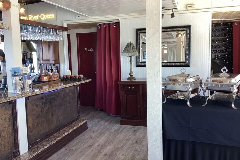 Indian River Queen Yacht Photos Pics Interior of a custom 1984 paddle wheel boat with buffet setup and bar area.