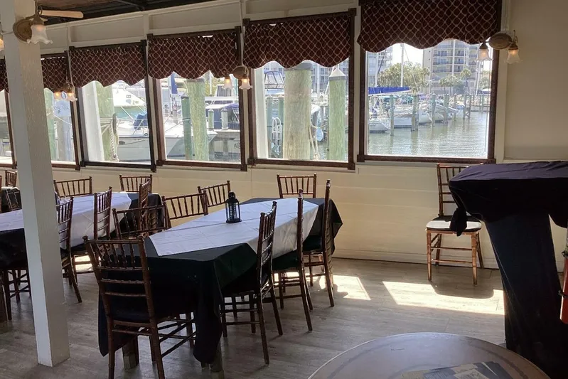 Indian River Queen Yacht Photos Pics Dining area with waterfront view, featuring elegant tables and chairs, Custom Paddle Wheel, 1984.
