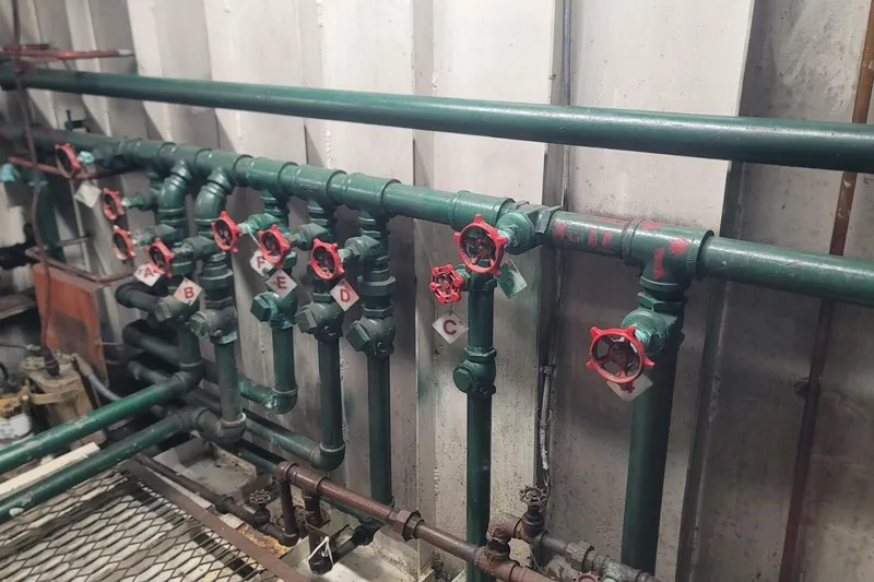 Indian River Queen Yacht Photos Pics Industrial piping system with labeled red valves, Custom Paddle Wheel, 1984.