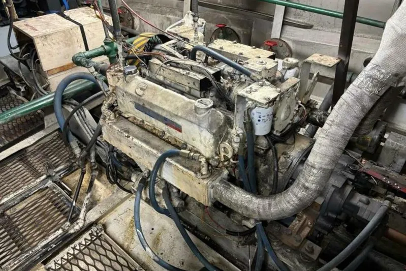 Indian River Queen Yacht Photos Pics 1984 Custom Paddle Wheel engine with hoses and mechanical components in a workshop setting.