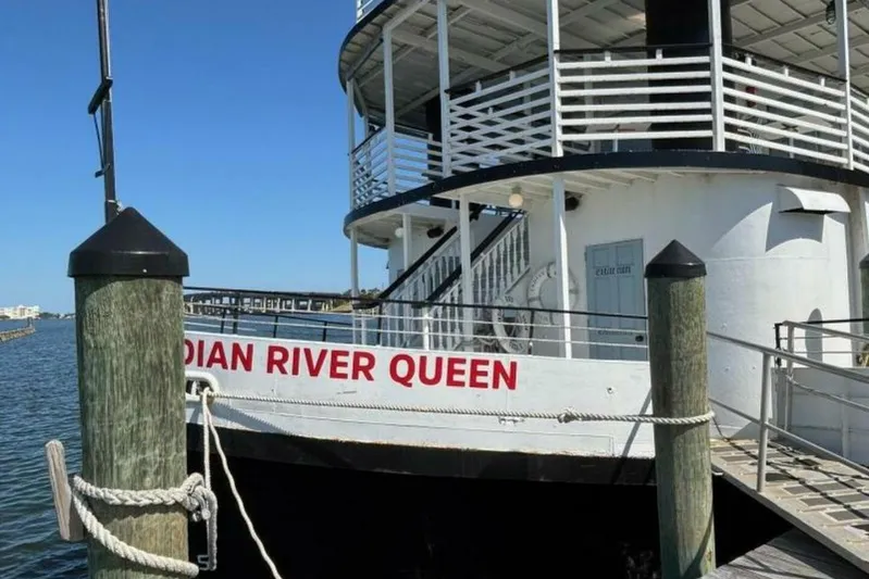 Indian River Queen Yacht Photos Pics Custom 1984 paddle wheel boat "Indian River Queen" docked at a pier.