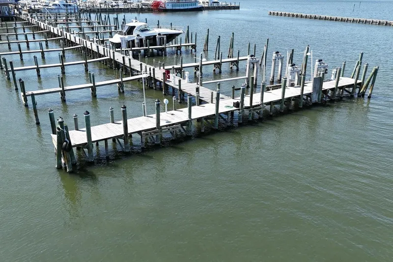 Indian River Queen Yacht Photos Pics Empty marina docks with a single boat, featuring a Custom Paddle Wheel from 1984.