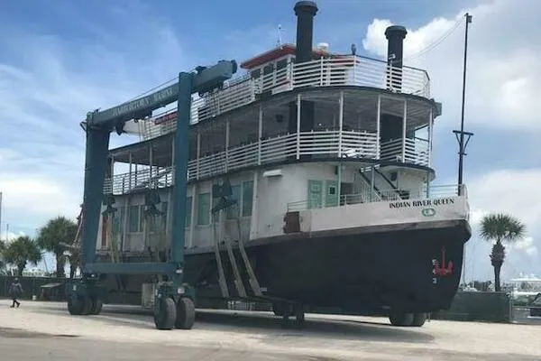 Indian River Queen Yacht Photos Pics A 1984 custom paddle wheel boat, "Indian River Queen," on a lift at a marina.