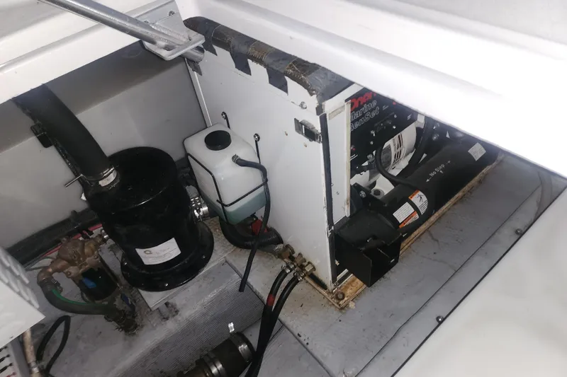 Teddy B Yacht Photos Pics Engine compartment of a 1997 Mainship 350 Trawler, showing mechanical components and wiring.