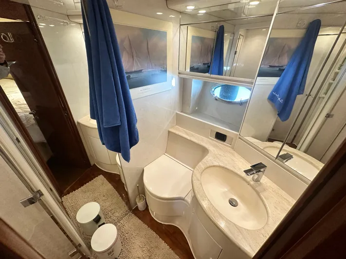  Yacht Photos Pics Luxurious bathroom in 2000 Pershing 54 yacht, featuring modern fixtures and elegant design.