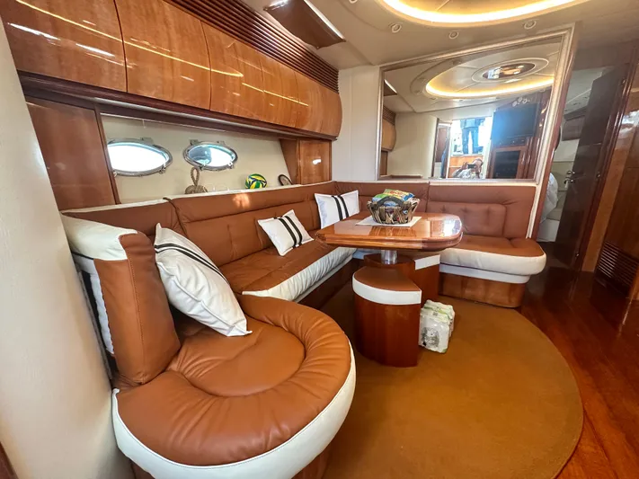  Yacht Photos Pics Luxurious interior of 2000 Pershing 54 yacht with elegant seating and wooden accents.