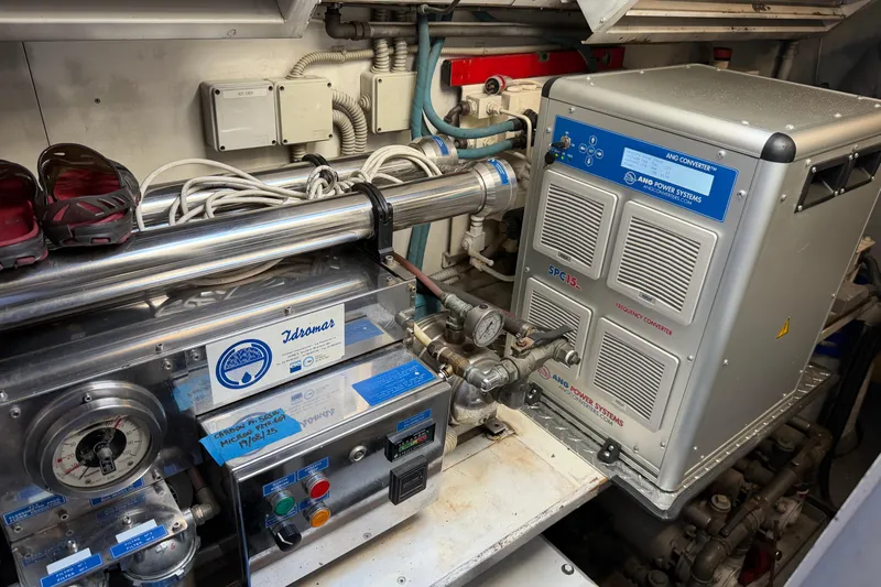  Yacht Photos Pics Engine room of a 2004 Mangusta 72 yacht featuring power systems and equipment.