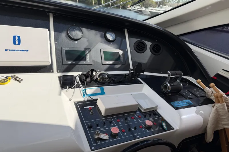  Yacht Photos Pics Control panel of a 2004 Mangusta 72 yacht with navigation equipment.