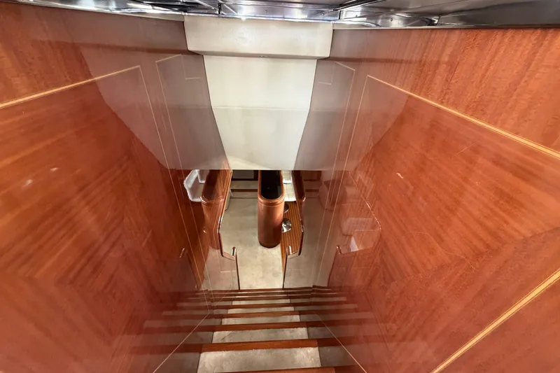  Yacht Photos Pics Staircase with polished wood finish inside 2004 Mangusta 72 yacht.