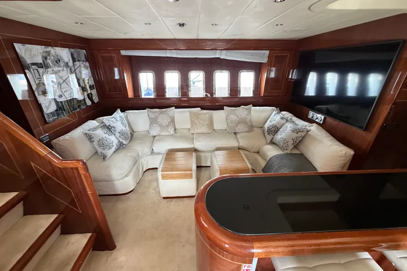  Yacht Photos Pics Luxurious 2004 Mangusta 72 yacht interior with plush seating and elegant wood finishes.