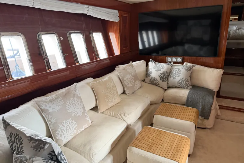  Yacht Photos Pics Luxurious interior of 2004 Mangusta 72 yacht with plush seating and elegant decor.