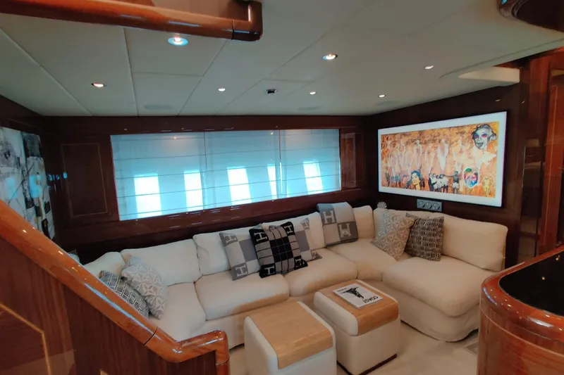  Yacht Photos Pics Luxurious interior of 2004 Mangusta 72 yacht with plush seating and modern artwork.
