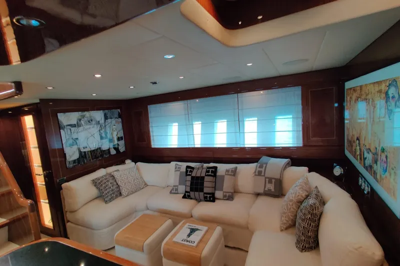  Yacht Photos Pics Luxurious interior of 2004 Mangusta 72 yacht with plush seating and elegant decor.