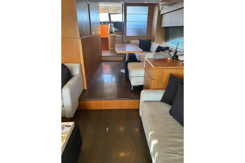 Big Blue Yacht Photos Pics Luxurious interior of 2014 Fairline Squadron 78 Custom yacht with elegant wood finishes.