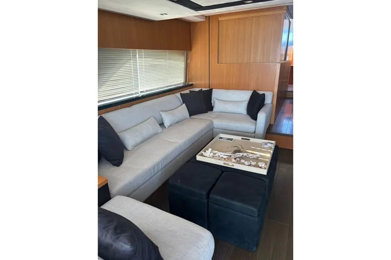 Big Blue Yacht Photos Pics Luxurious interior of 2014 Fairline Squadron 78 Custom yacht with elegant seating area.