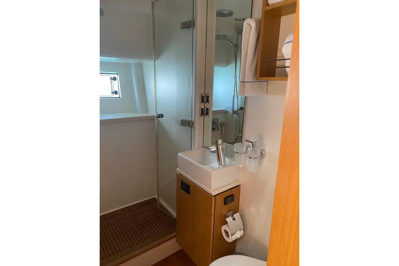 Big Blue Yacht Photos Pics Luxurious bathroom in 2014 Fairline Squadron 78 Custom yacht, featuring modern fixtures and wooden accents.