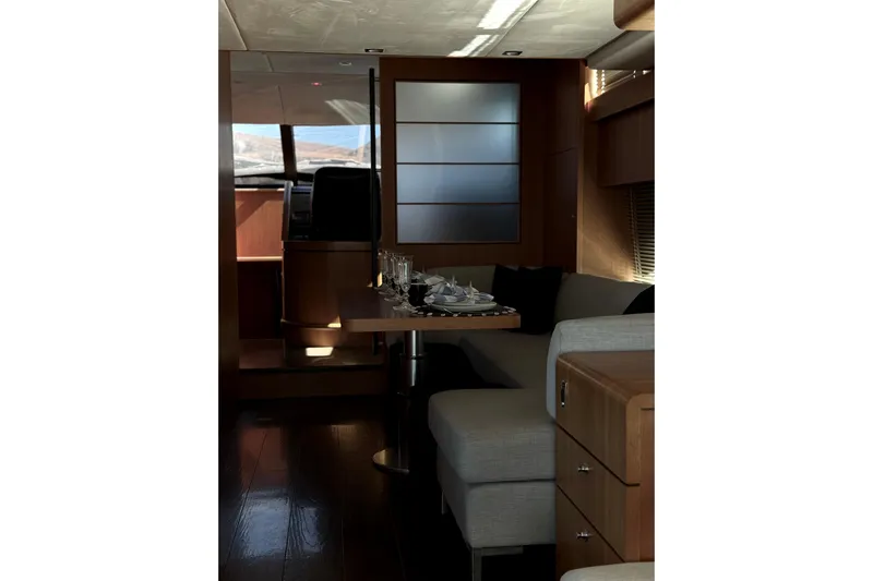 Big Blue Yacht Photos Pics Luxurious interior of 2014 Fairline Squadron 78 Custom yacht with elegant dining setup.