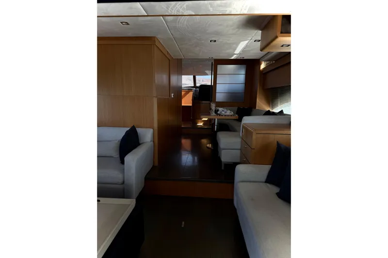 Big Blue Yacht Photos Pics Interior of 2014 Fairline Squadron 78 Custom yacht with modern furnishings and wood paneling.