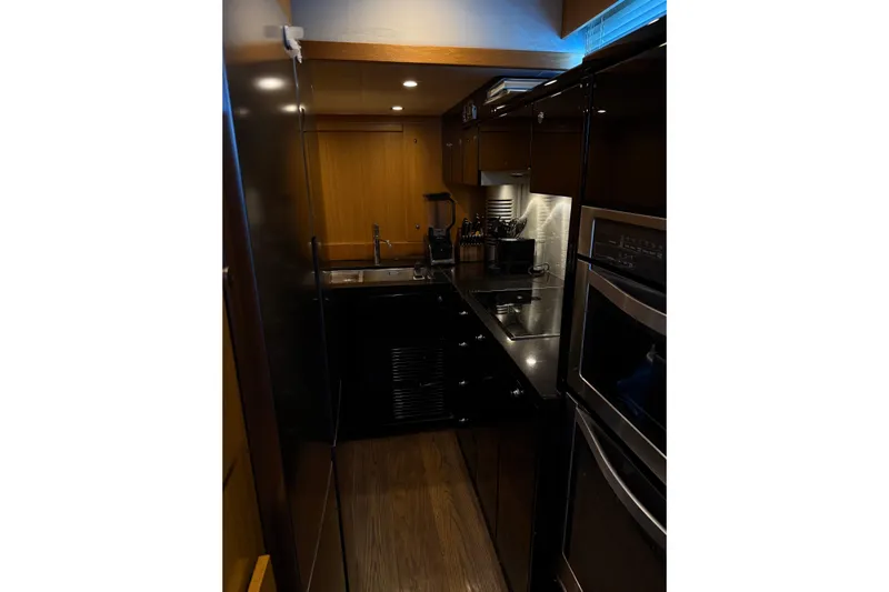 Big Blue Yacht Photos Pics Luxurious kitchen interior of 2014 Fairline Squadron 78 Custom yacht.