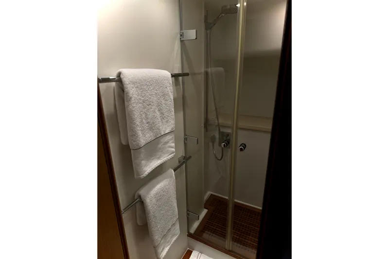 Big Blue Yacht Photos Pics Bathroom with glass shower and towels in 2014 Fairline Squadron 78 Custom yacht.