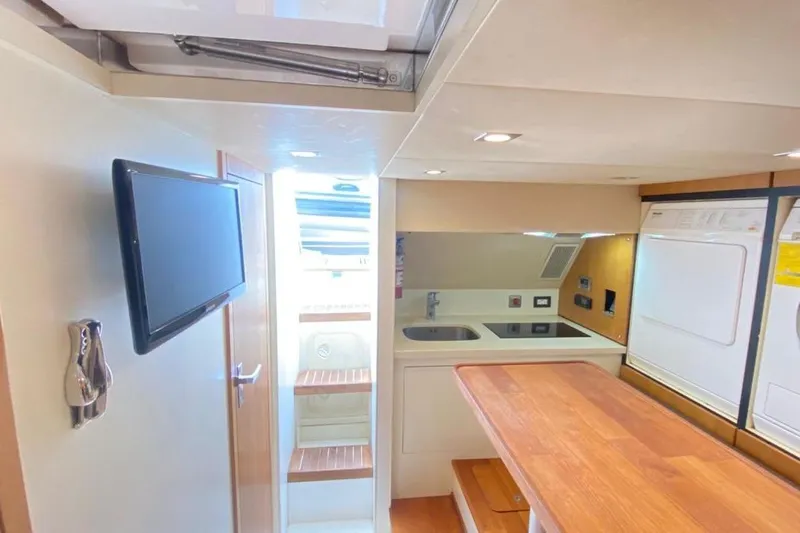 Big Blue Yacht Photos Pics Luxurious 2014 Fairline Squadron 78 Custom yacht interior with modern kitchen and appliances.