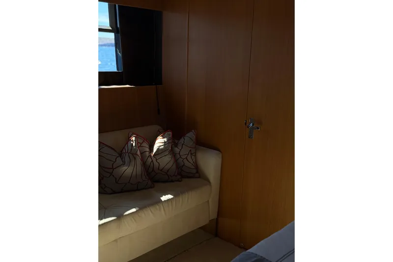 Big Blue Yacht Photos Pics Interior of 2014 Fairline Squadron 78 Custom yacht with sofa and decorative pillows.