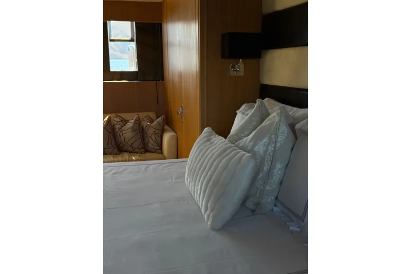 Big Blue Yacht Photos Pics Luxurious bedroom interior of 2014 Fairline Squadron 78 Custom yacht with plush pillows.