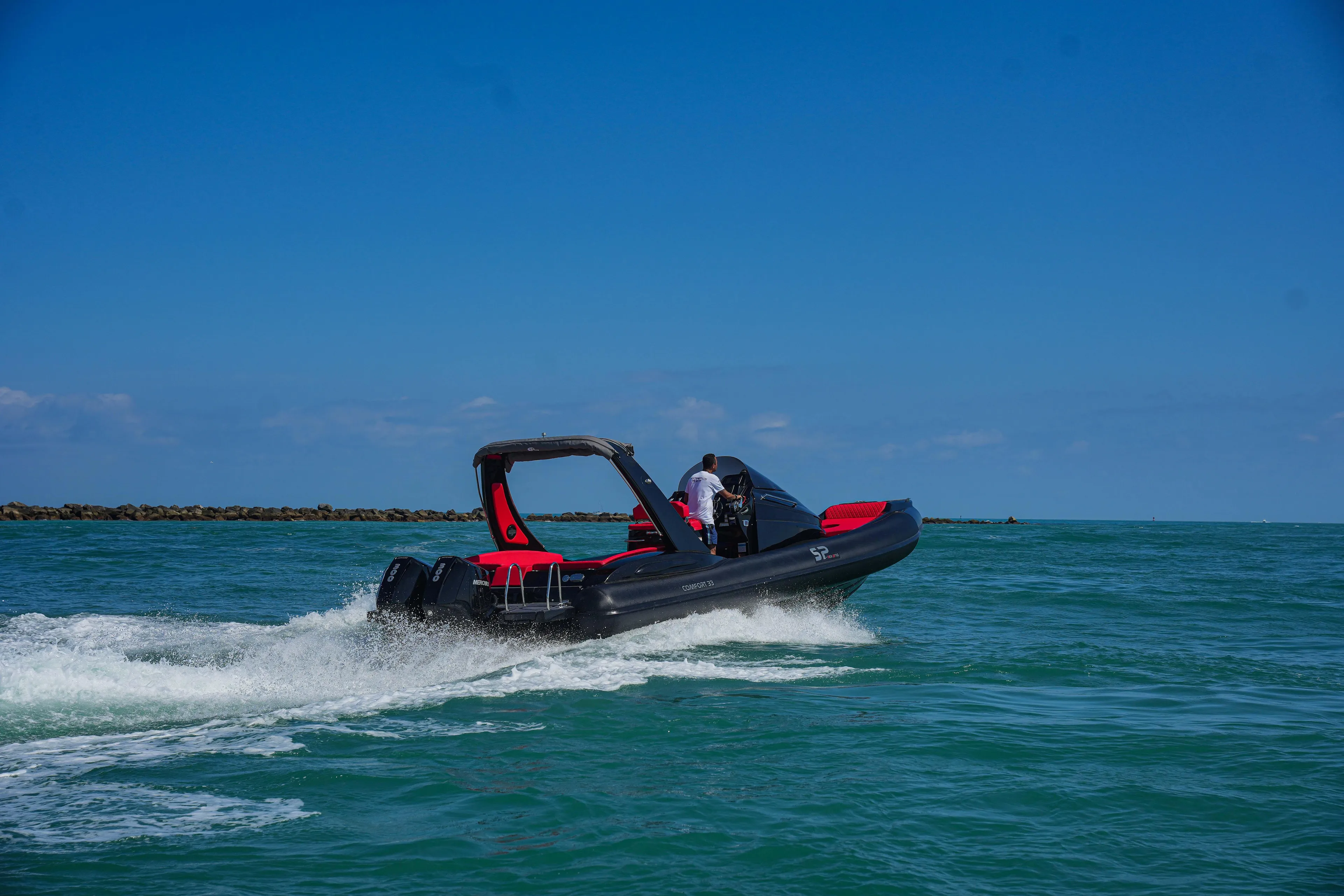 2025 Sea Prop COMFORT 33 speedboat cruising on open water.