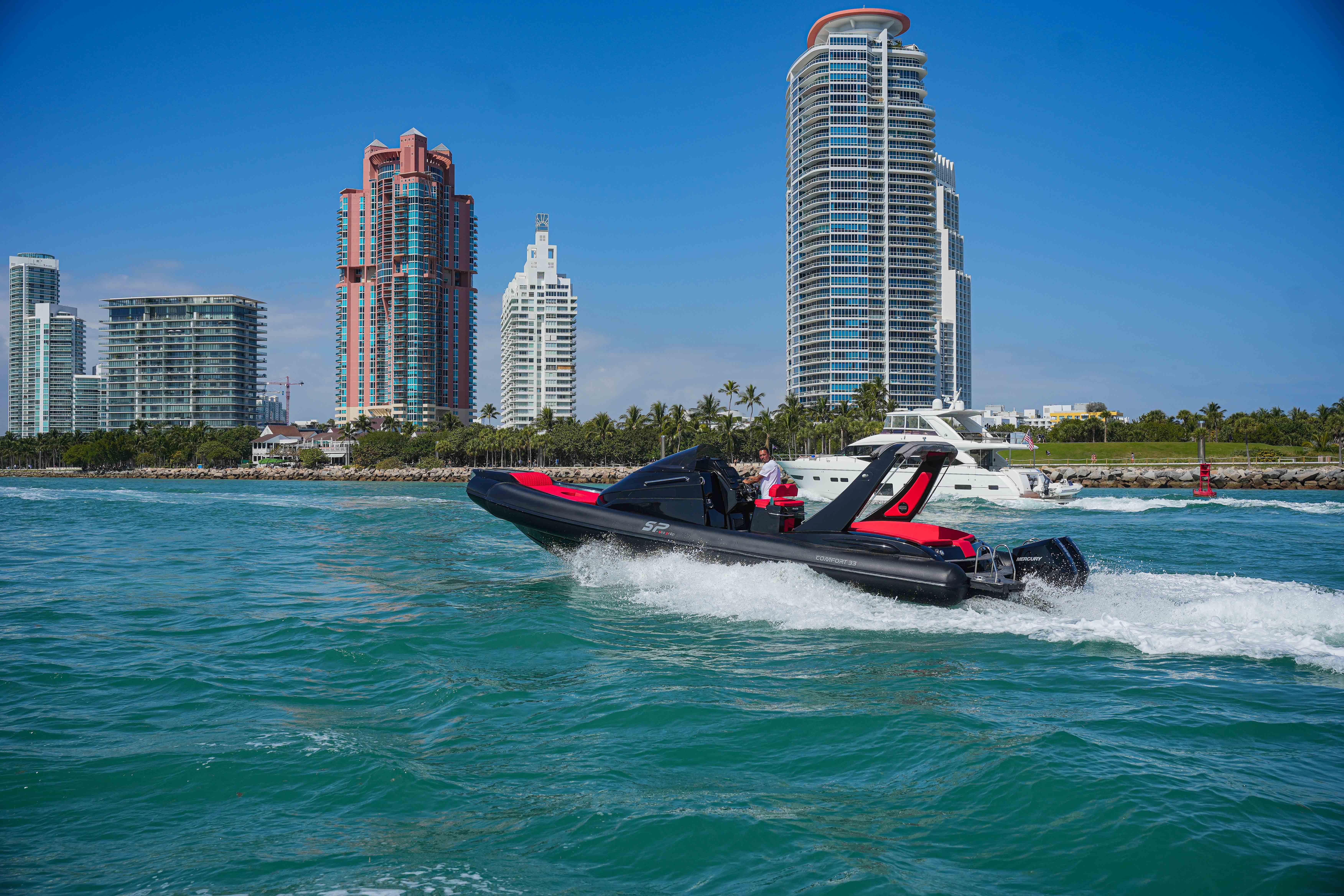 Sea Prop COMFORT 33 boat cruising near city skyline, 2025 model.