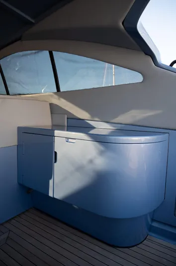 Azaxaki Yacht Photos Pics Interior of 1995 Magnum 50 Bestia yacht with sleek cabinetry and modern design.