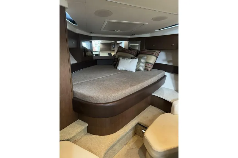  Yacht Photos Pics 2016 Sea Ray 350 Sundancer cabin interior with cozy bed and stylish decor.