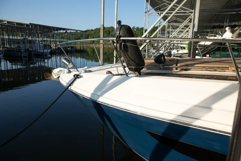  Yacht Photos Pics 2016 Sea Ray 350 Sundancer docked at marina under clear blue sky.