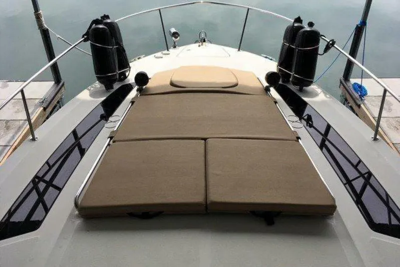  Yacht Photos Pics 2016 Sea Ray 350 Sundancer boat with cushioned deck, docked at marina.