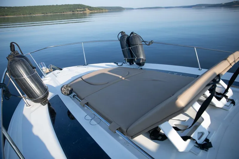  Yacht Photos Pics 2016 Sea Ray 350 Sundancer boat with sun loungers on calm water.