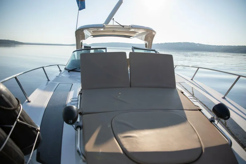  Yacht Photos Pics 2016 Sea Ray 350 Sundancer boat with sun deck on calm water.