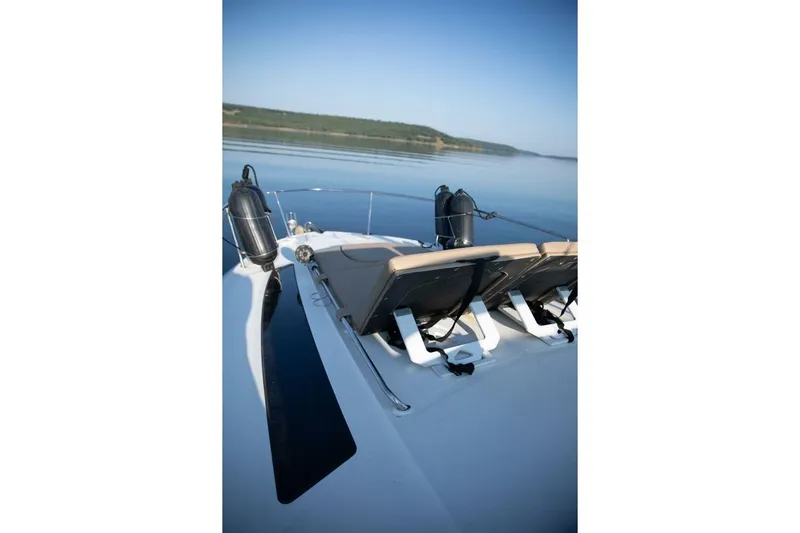  Yacht Photos Pics 2016 Sea Ray 350 Sundancer boat with deck chairs on calm water.