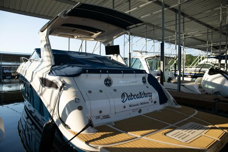  Yacht Photos Pics 2016 Sea Ray 350 Sundancer docked in a marina, rear view.
