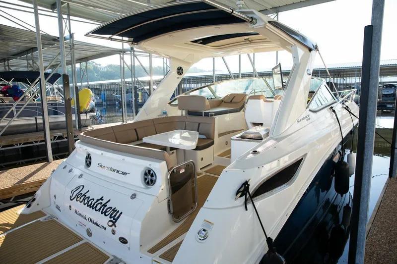  Yacht Photos Pics 2016 Sea Ray 350 Sundancer docked, featuring spacious seating and sleek design.