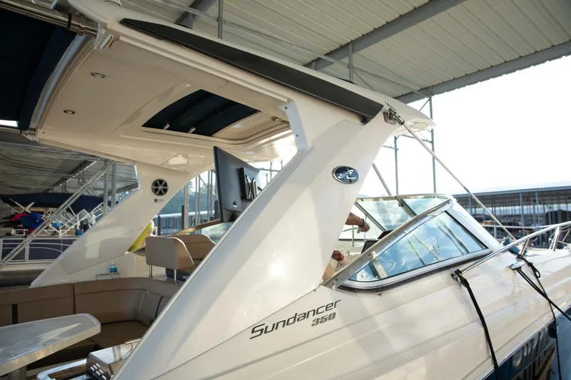  Yacht Photos Pics 2016 Sea Ray 350 Sundancer yacht docked under a covered marina.