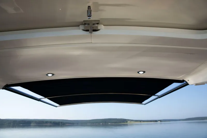  Yacht Photos Pics 2016 Sea Ray 350 Sundancer boat canopy with scenic water view.