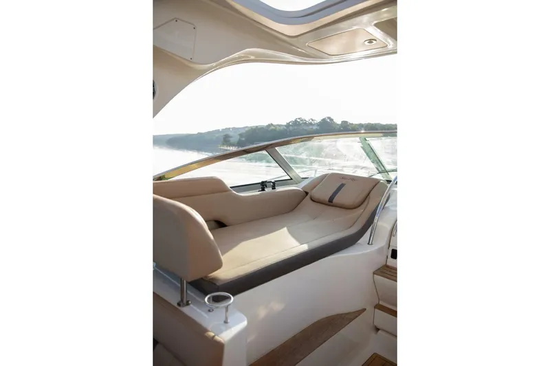  Yacht Photos Pics Luxurious seating area on 2016 Sea Ray 350 Sundancer yacht, featuring elegant design and scenic view.