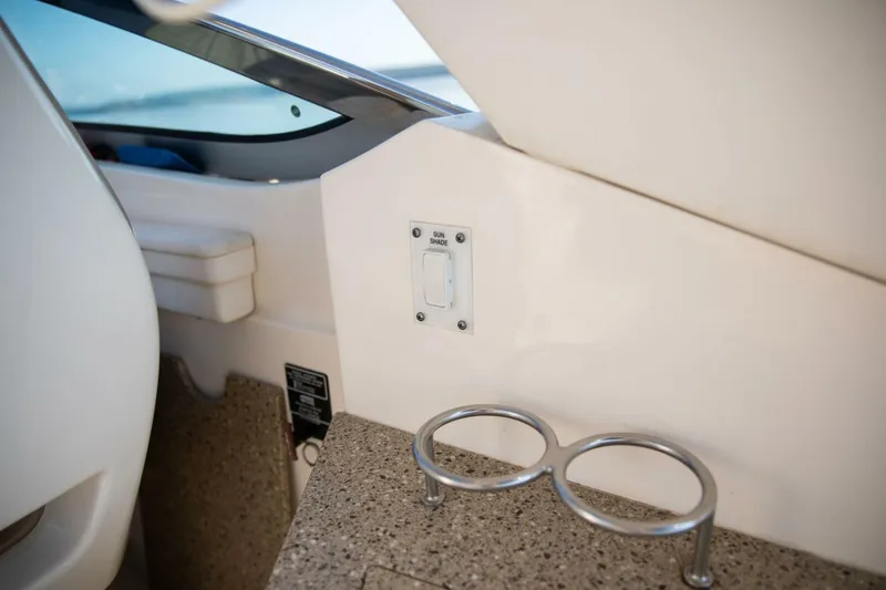  Yacht Photos Pics Interior of 2016 Sea Ray 350 Sundancer with cup holders and switch panel.