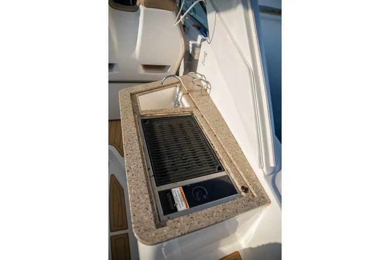  Yacht Photos Pics Outdoor kitchenette on 2016 Sea Ray 350 Sundancer with grill and sink.